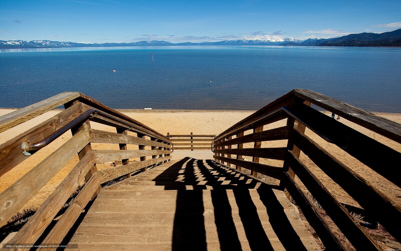 Wooden stairs to a lakeside beach