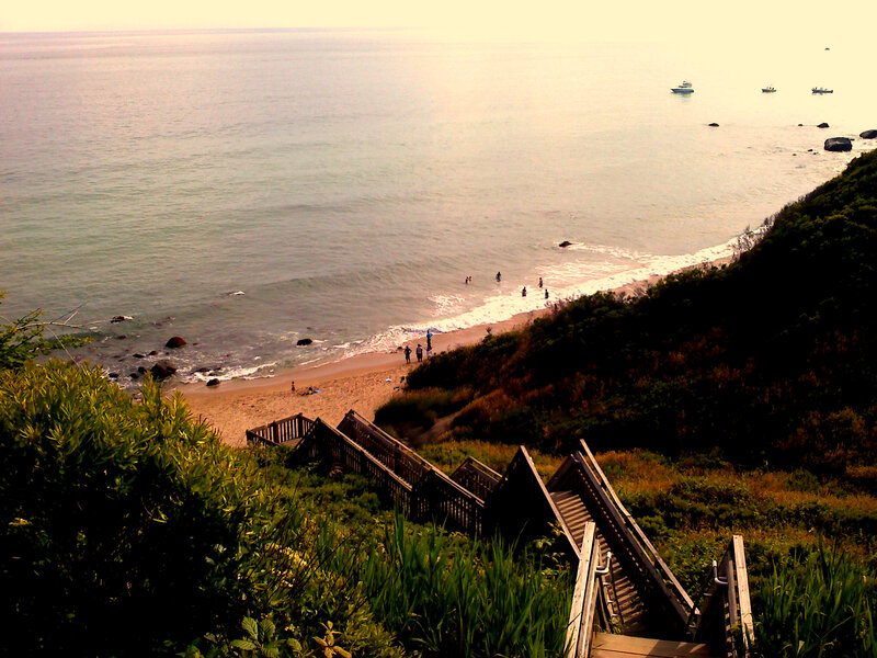 Wooden stairs to beach at sunset