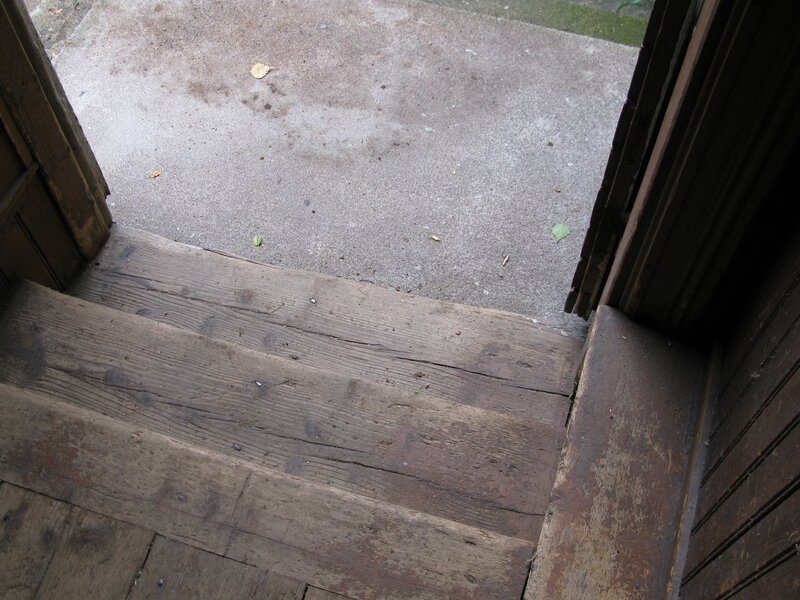 wooden steps to concrete ground
