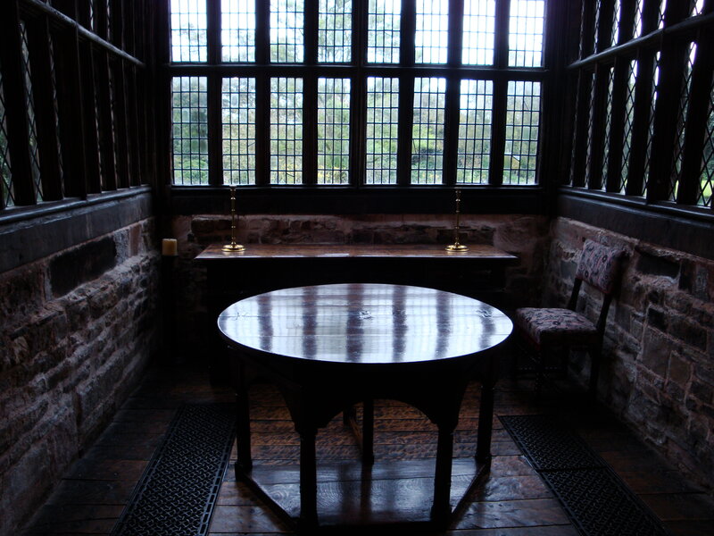 wooden table in stone room