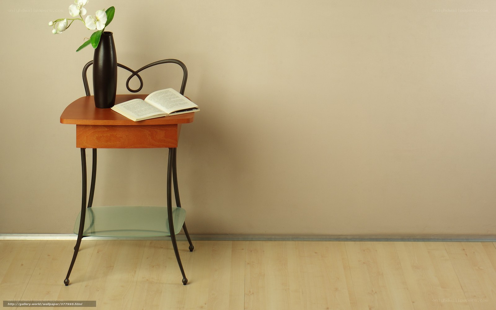 Wooden table with book and flowers