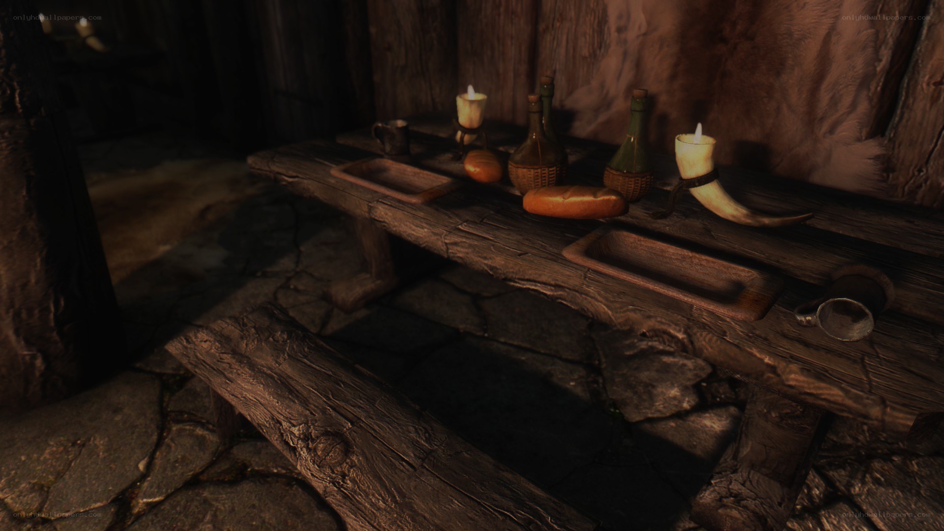 wooden table with candles and bread
