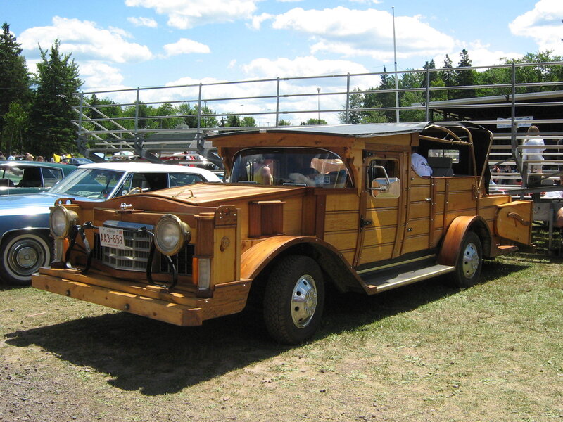 Wooden vintage car at outdoor show