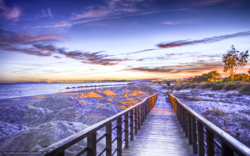 Wooden walkway at beach sunset