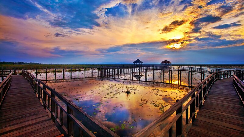 Wooden walkway at sunset