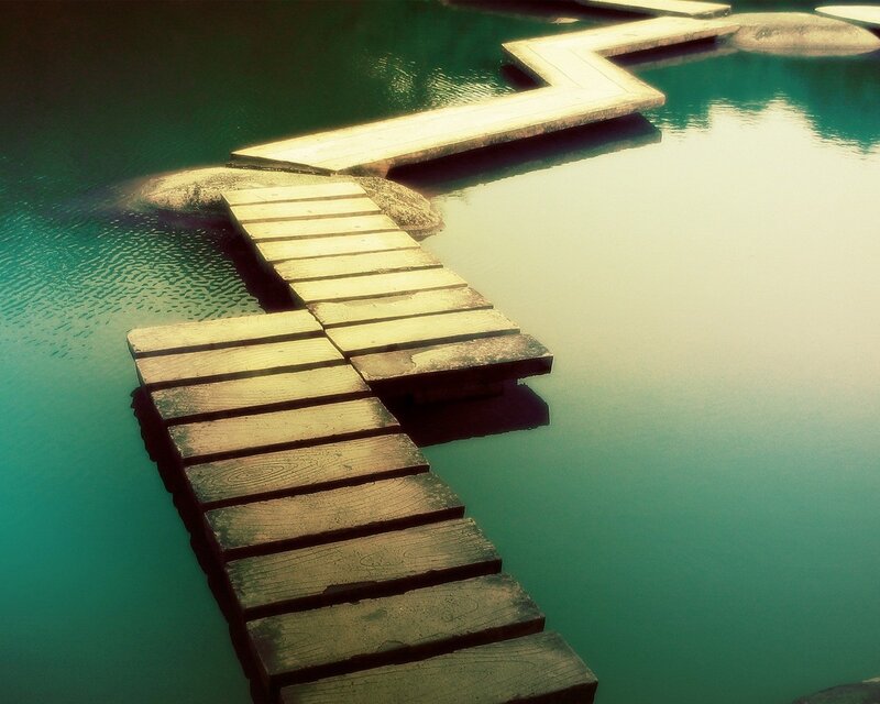 Wooden walkway over calm water