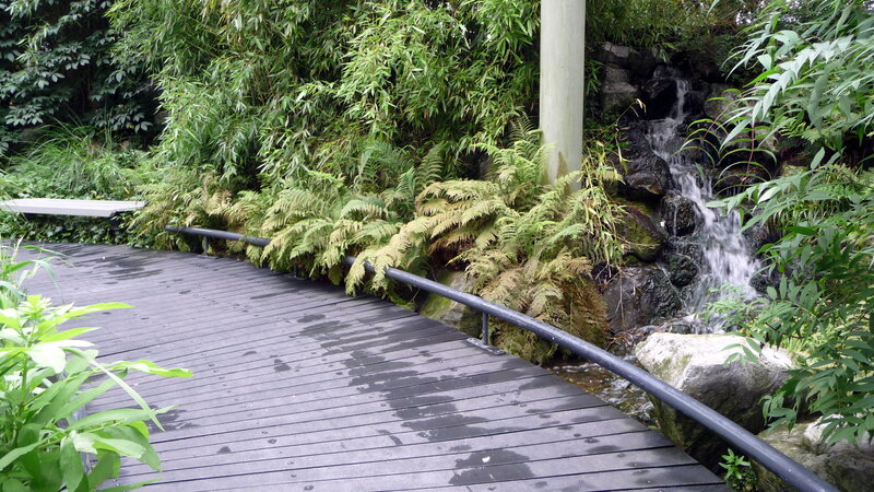 Wooden Walkway with Waterfall