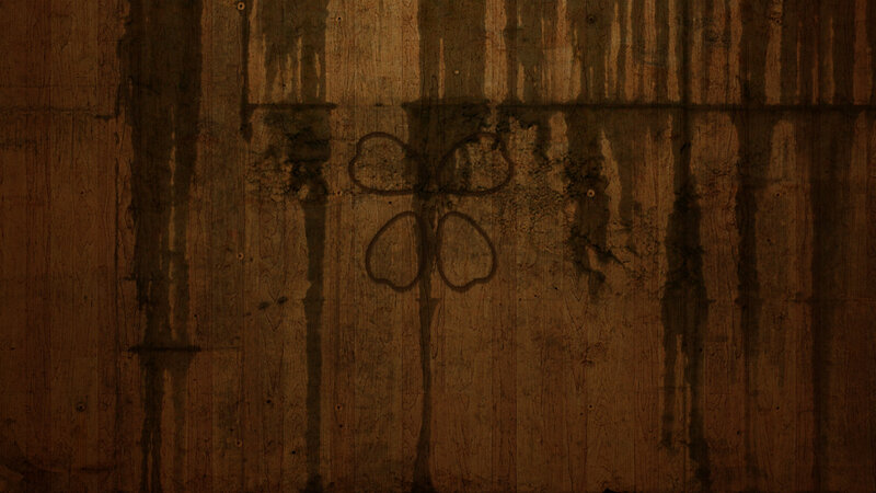 wooden wall with clover drawing
