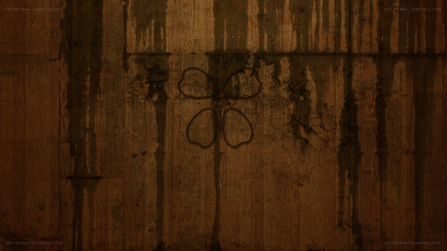 wooden wall with clover drawing