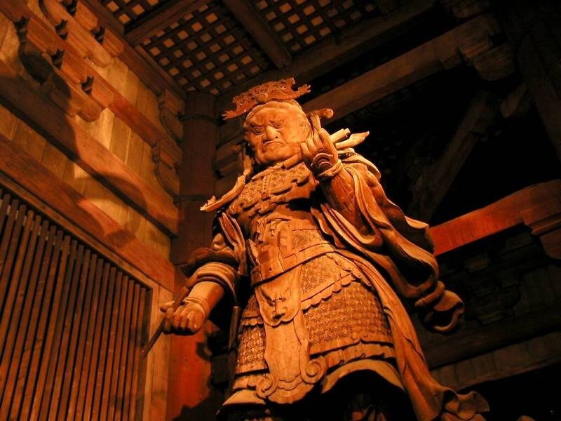 wooden warrior statue in temple
