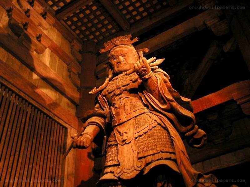 wooden warrior statue in temple