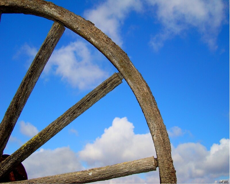 wooden wheel against blue sky