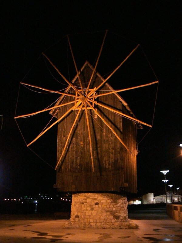 Wooden windmill at night