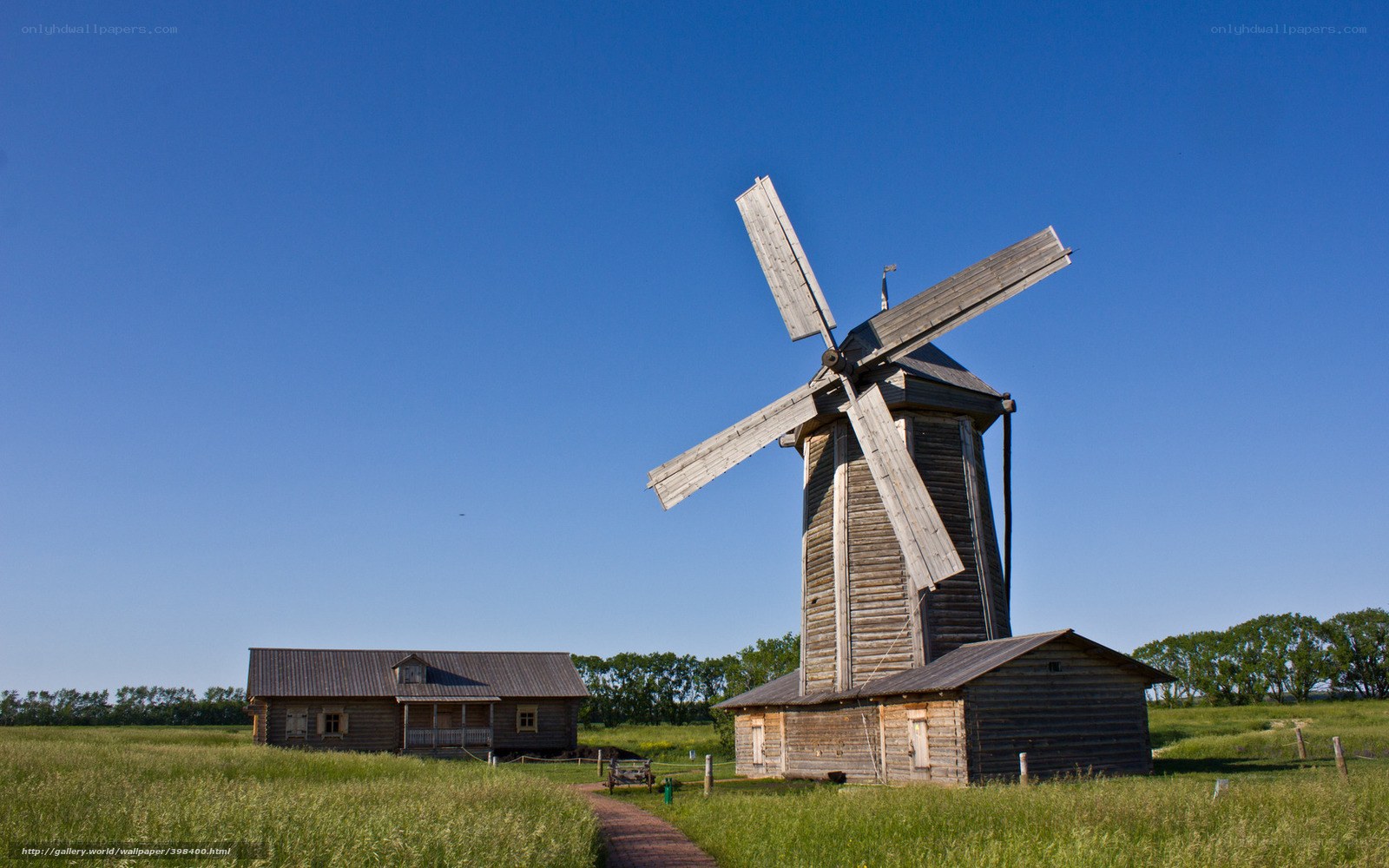 Wooden windmill in a field