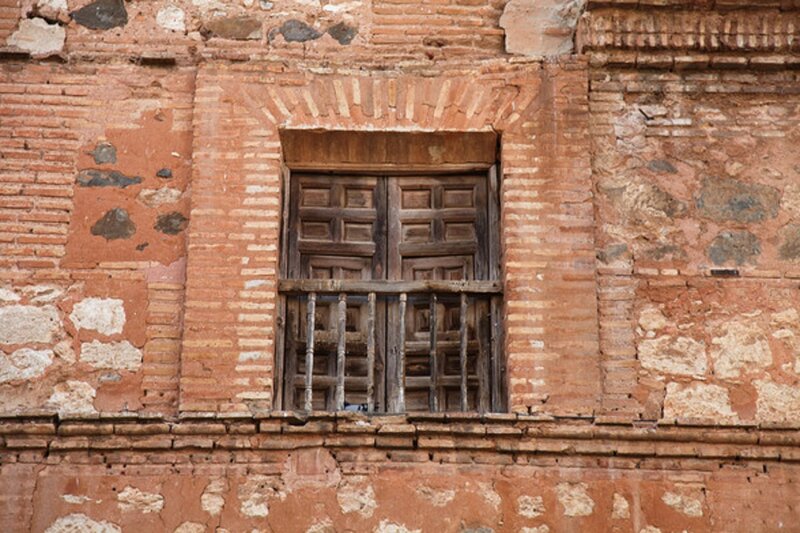 Wooden Window in Brick Wall