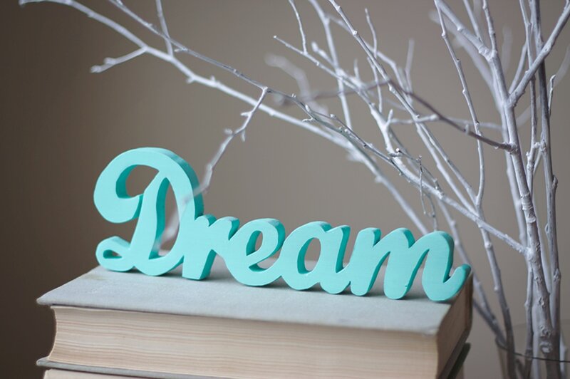 Wooden Word on Books