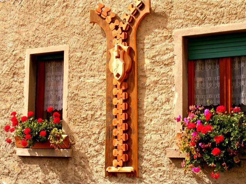 Wooden zipper sculpture on a house