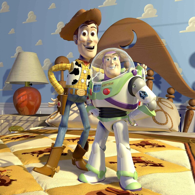 Woody and Buzz Lightyear on a bed
