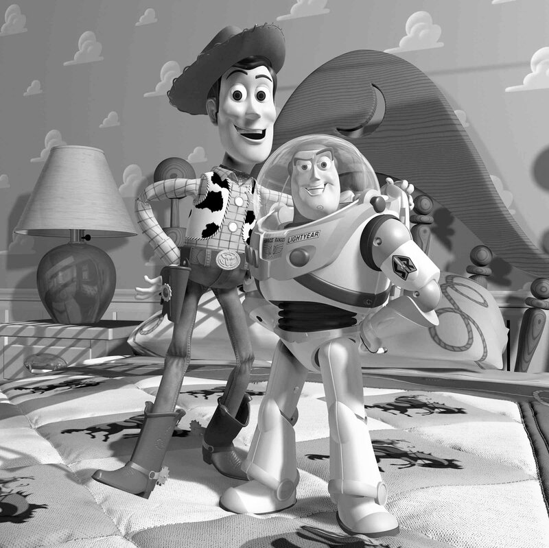 Woody and Buzz Lightyear on a bed