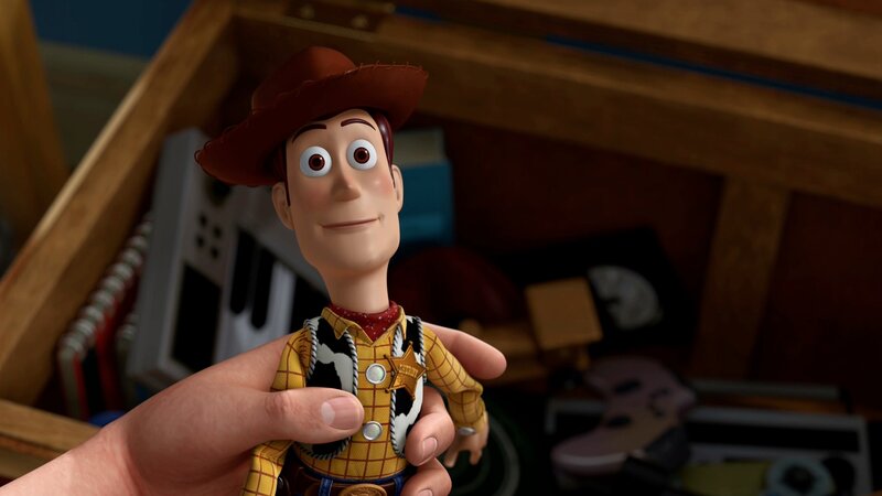 Woody toy in hand
