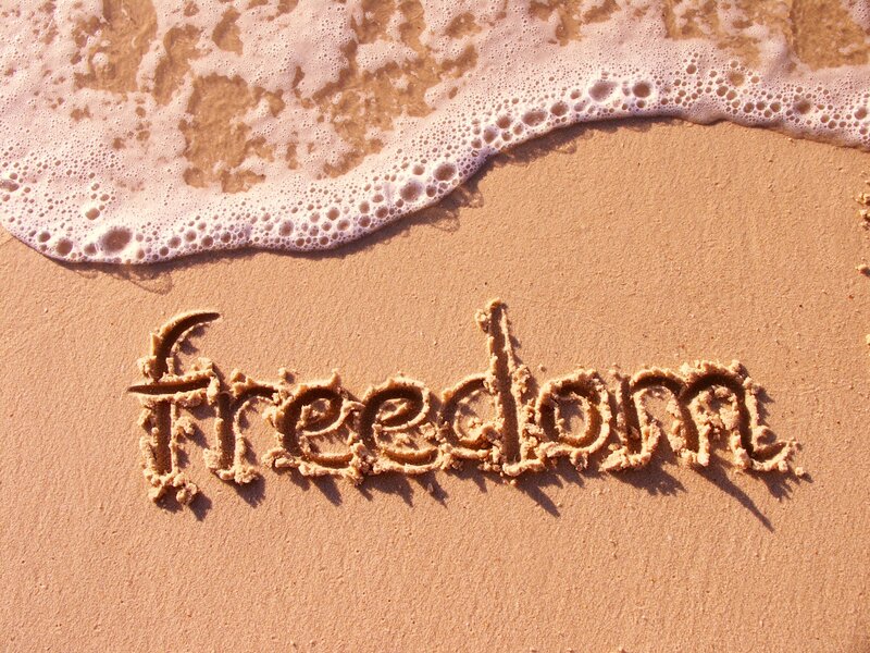 Word Freedom in Sand — Brown, Serene, Afternoon, Photograph, Wave
