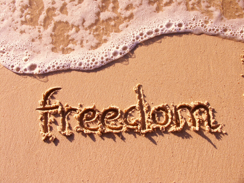 Word Freedom in Sand — Brown, Serene