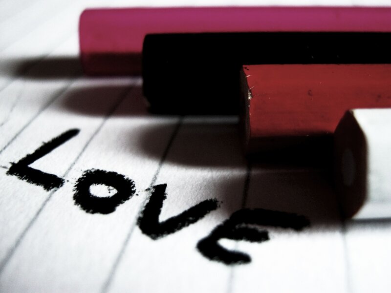 Word Love Written on Paper