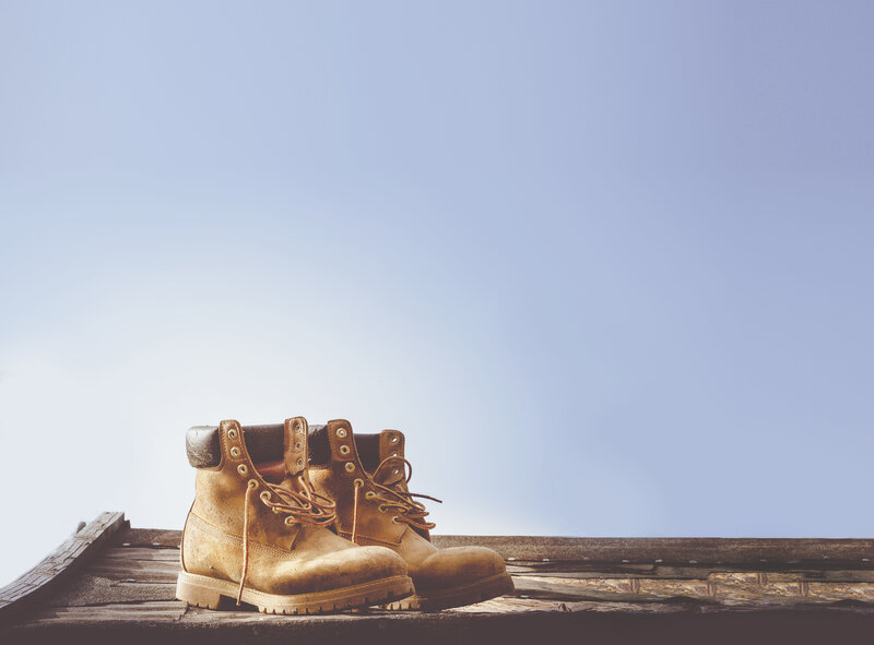 Work boots on wooden surface