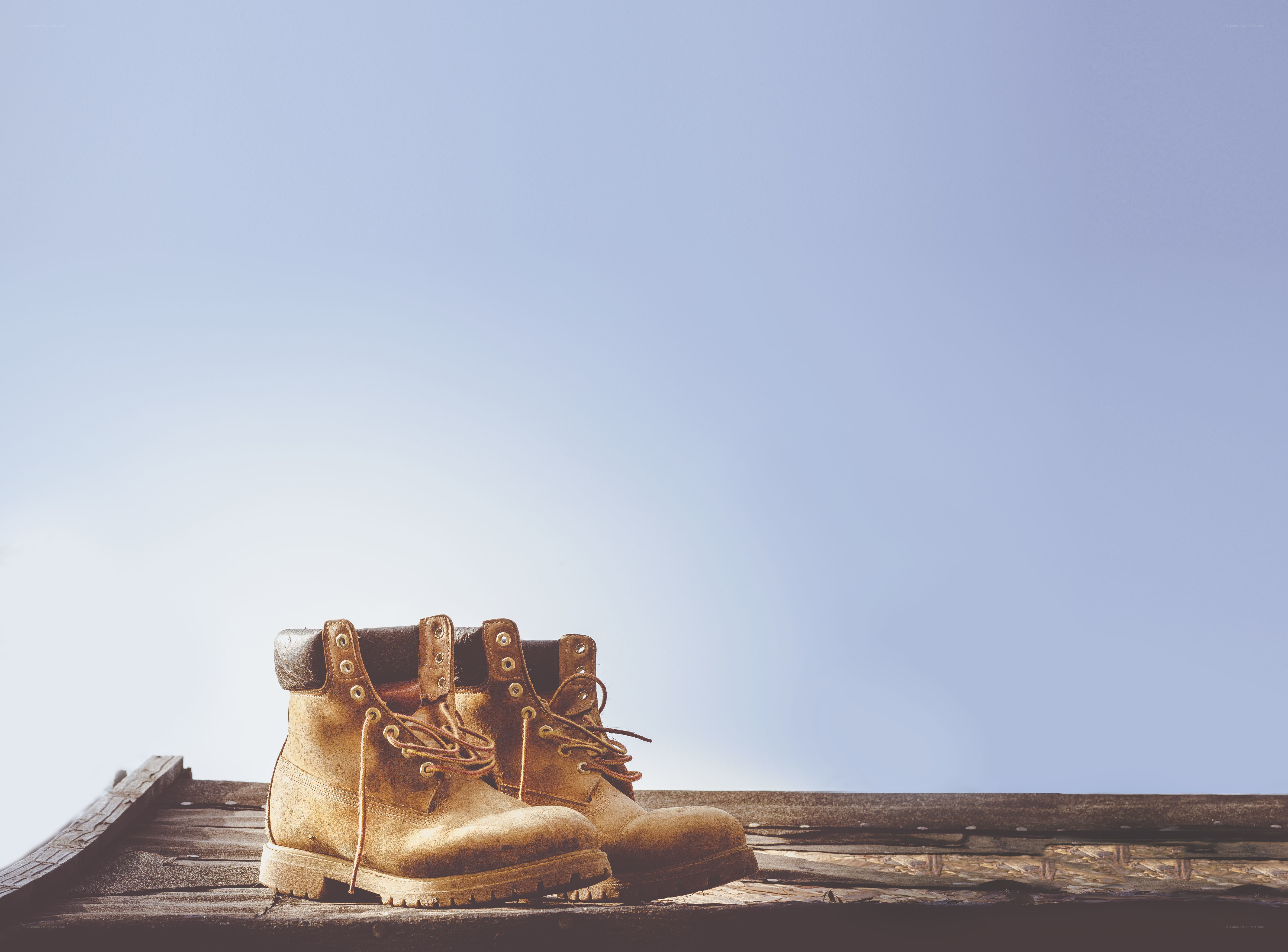 Work boots on wooden surface