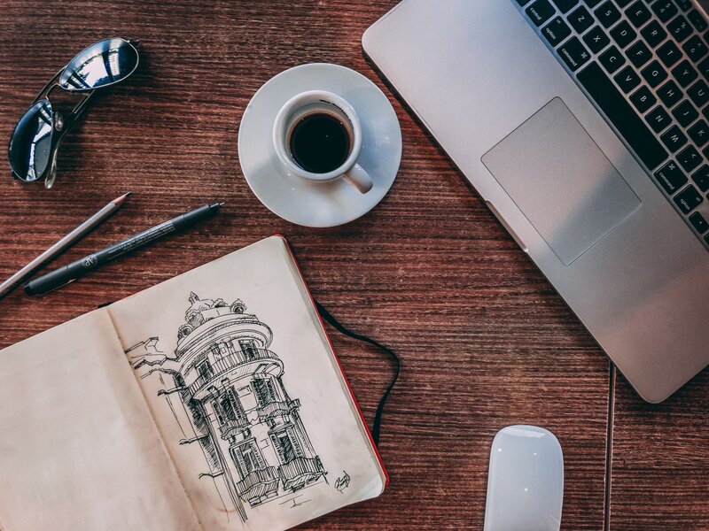 Work desk with coffee and sketchbook