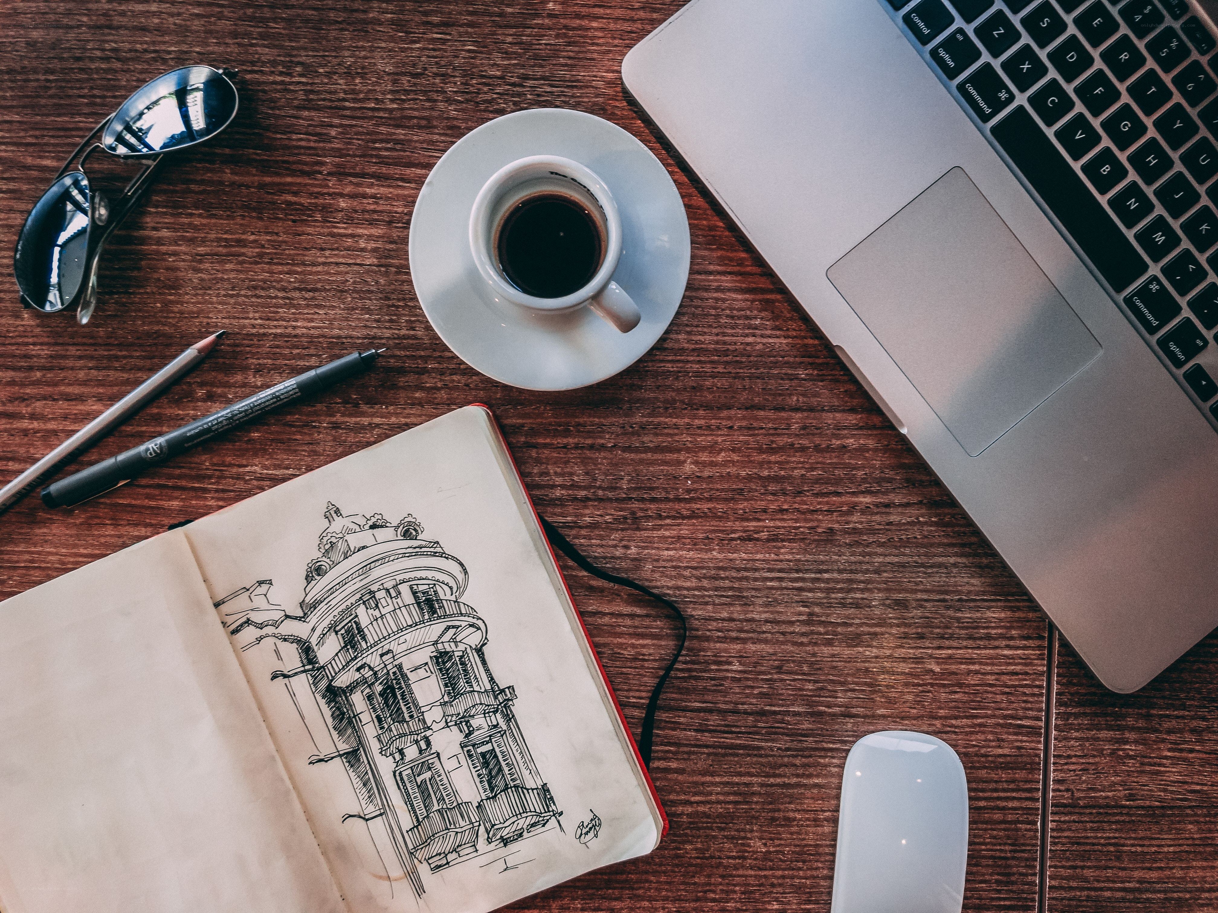 Work desk with coffee and sketchbook