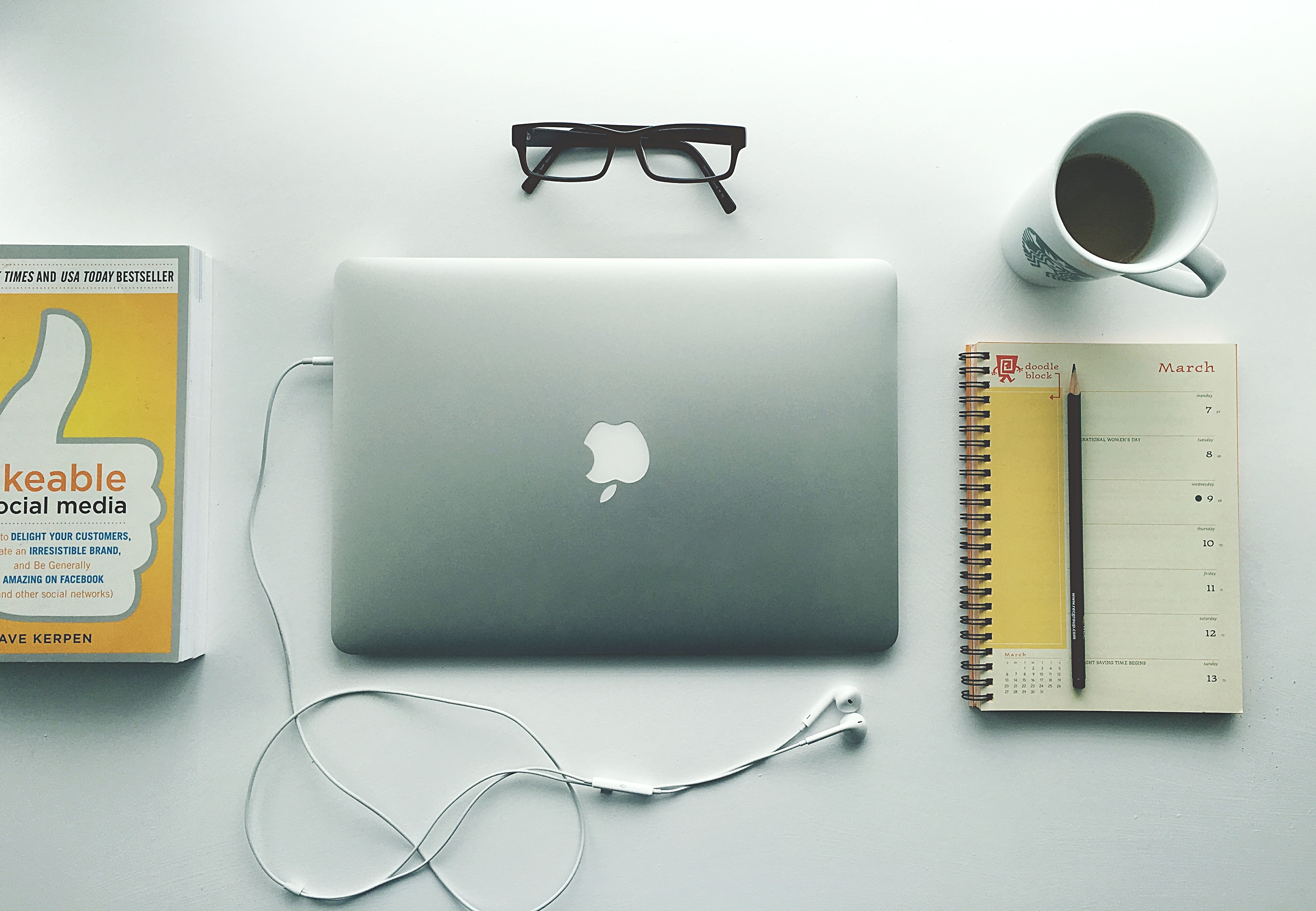 Work desk with laptop and book