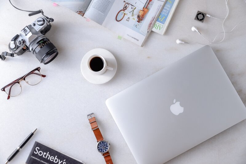 Work desk with laptop and camera