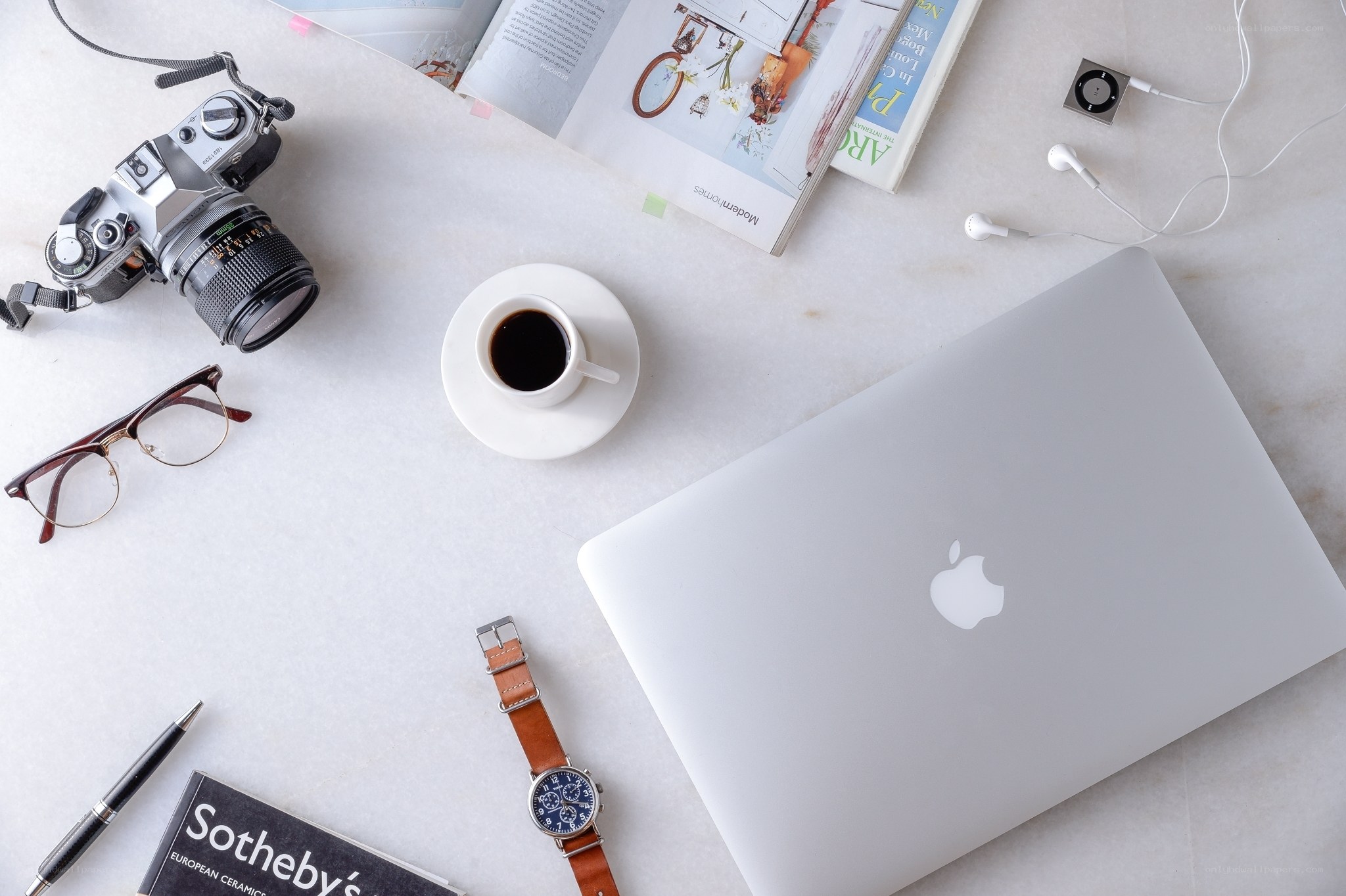 Work desk with laptop and camera