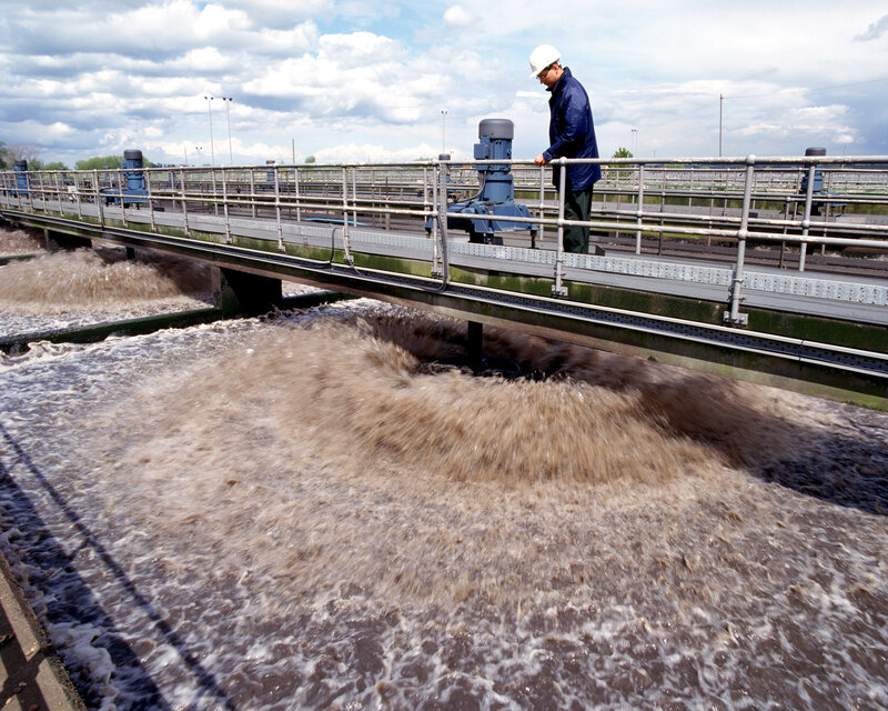 Worker at wastewater treatment plant