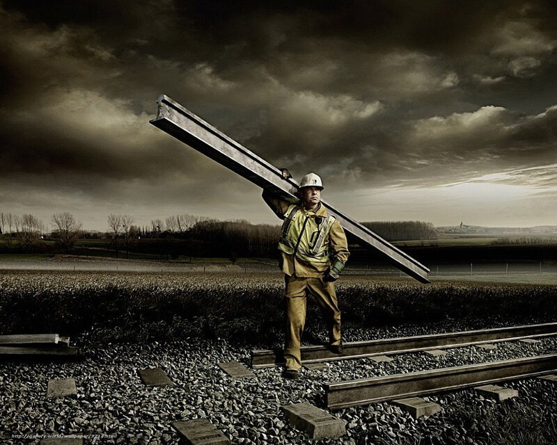 Worker carrying steel beam