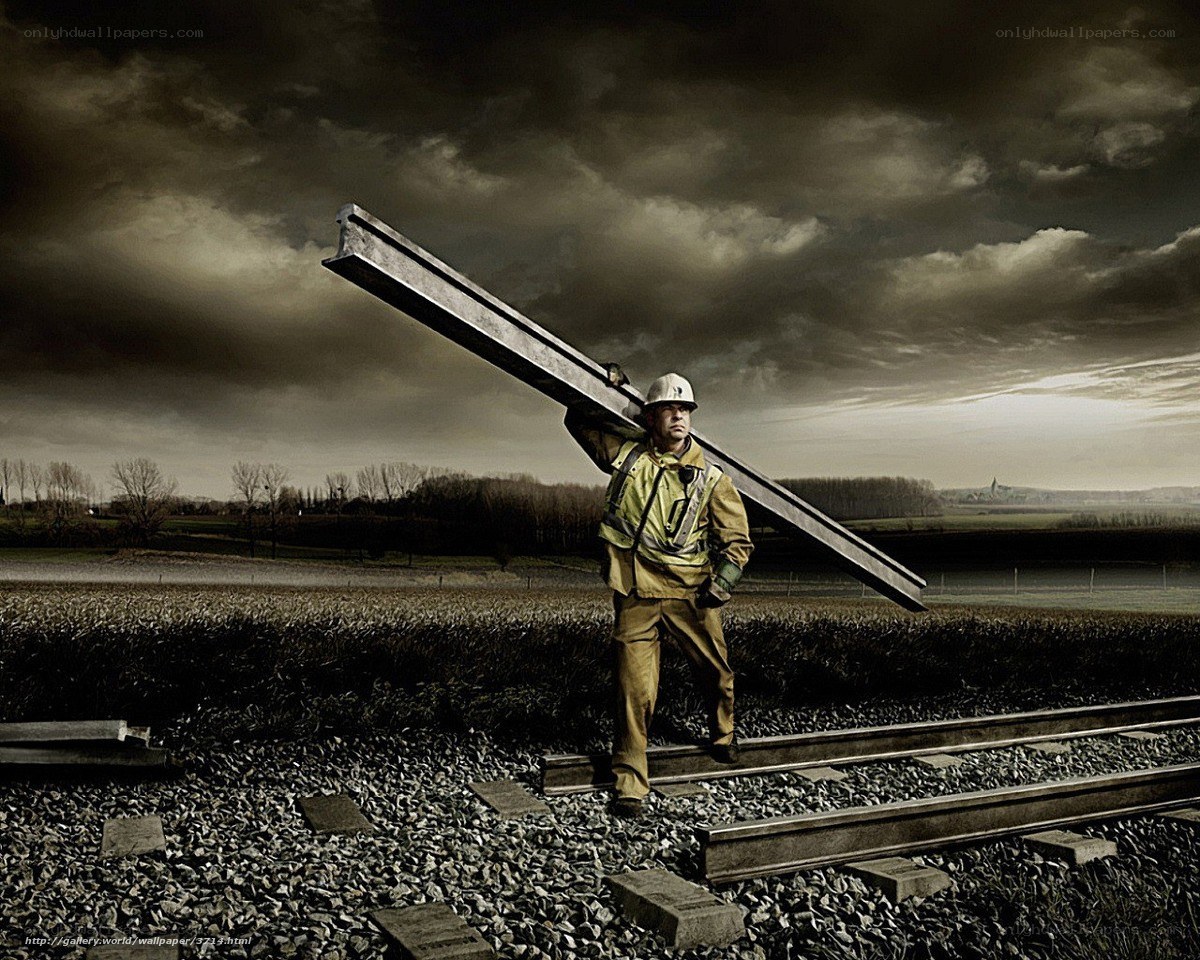 Worker carrying steel beam