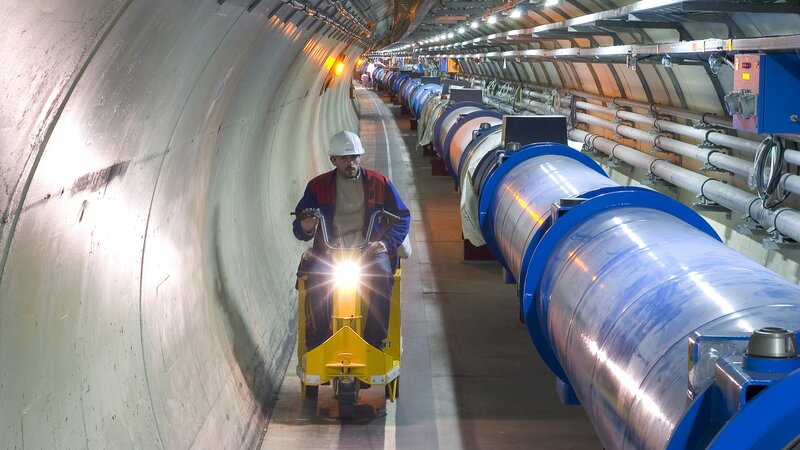 Worker in a particle accelerator tunnel