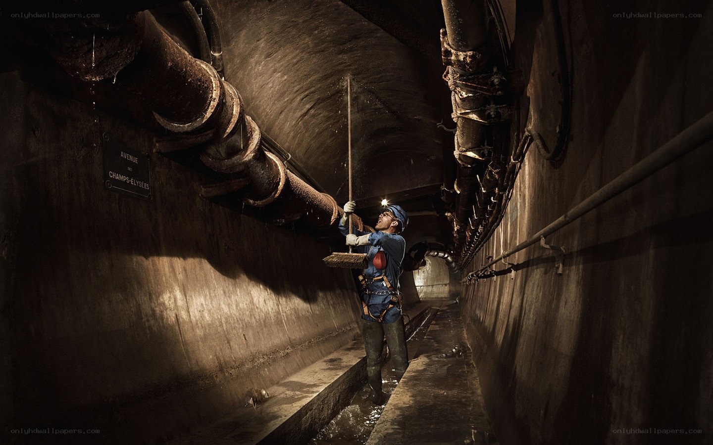 Worker in underground tunnel