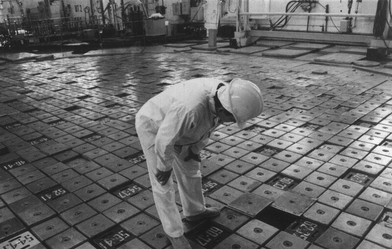 Worker inspecting reactor components