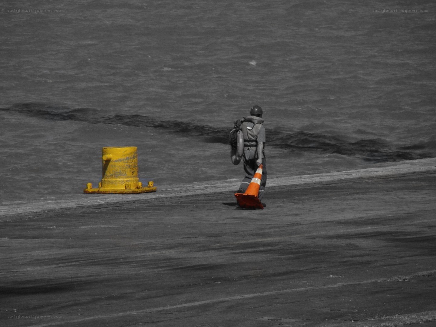 Worker near the water's edge