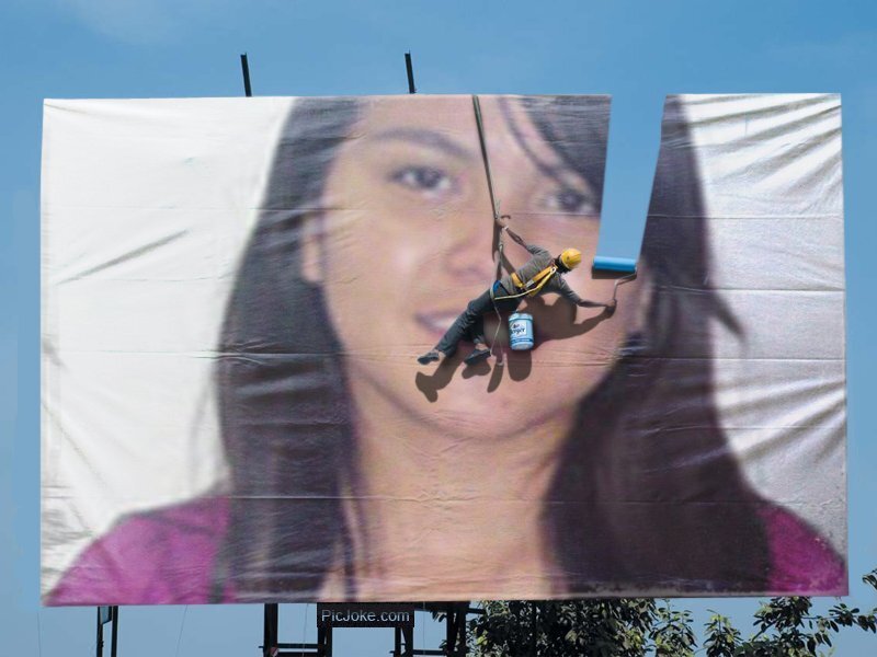 worker on a billboard