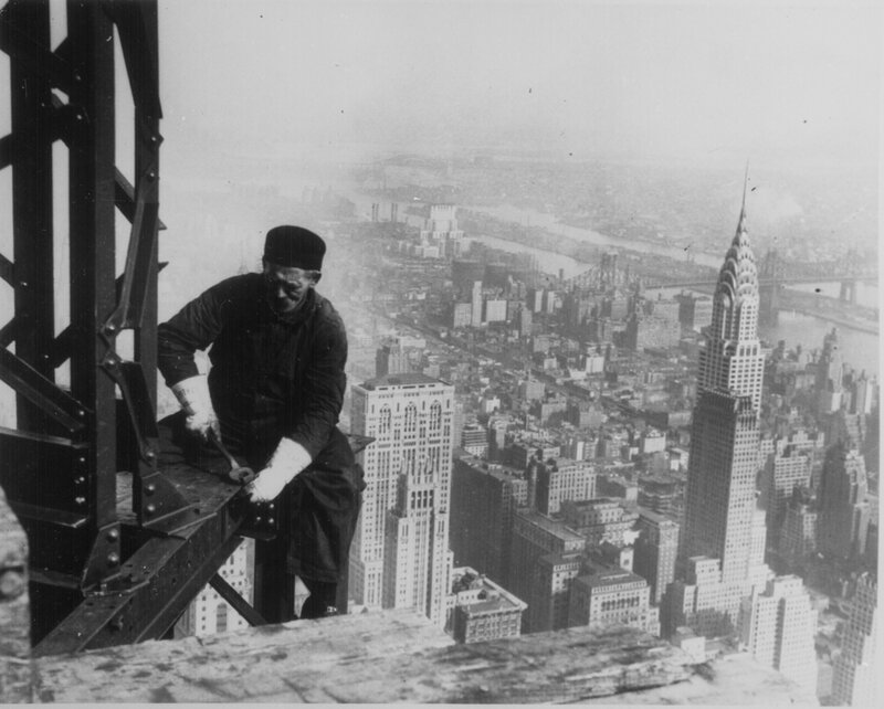 Worker on skyscraper beam