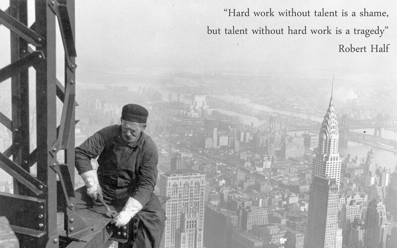 Worker on skyscraper beam