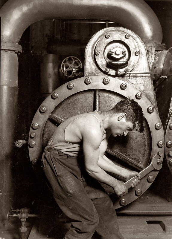 Worker operating industrial valve