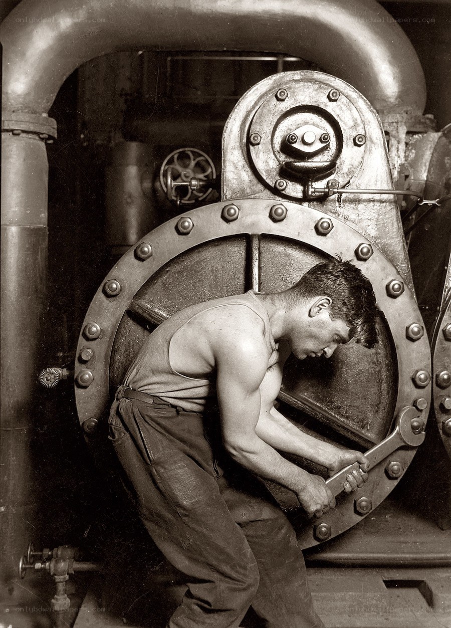 Worker operating industrial valve