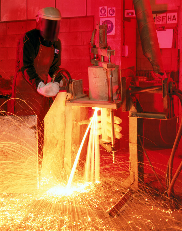 Worker operating welding machine