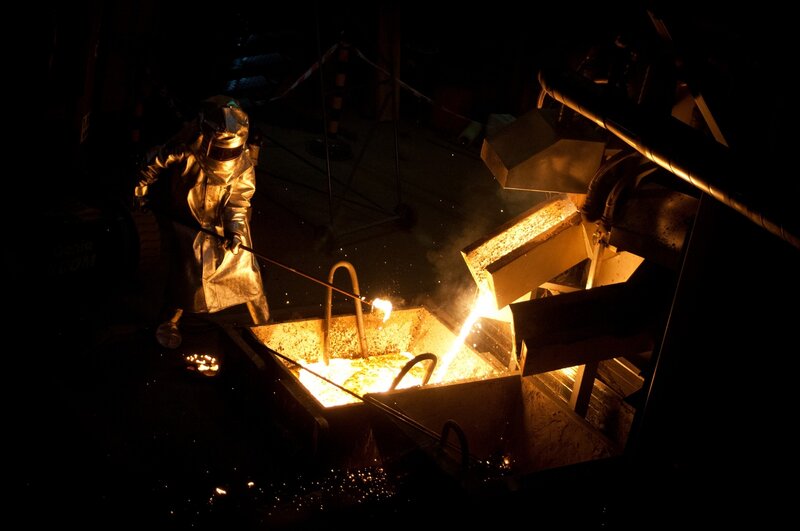 Worker Pouring Molten Metal — Black
