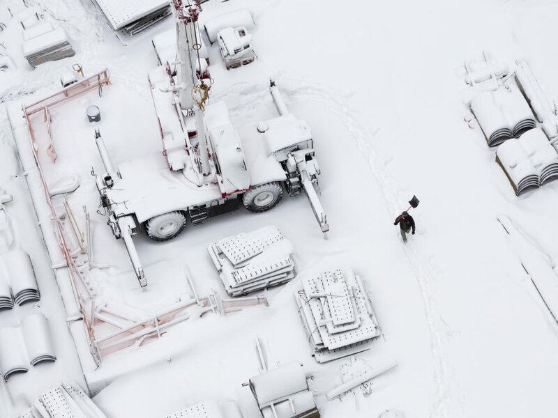 Worker with Shovel in Snow