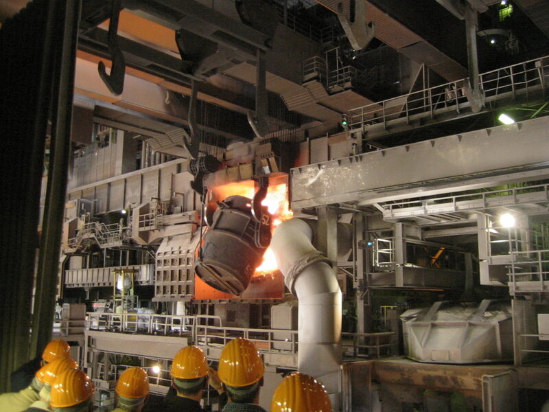 Workers at a steel mill